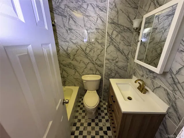 a bathroom with a sink and toilet