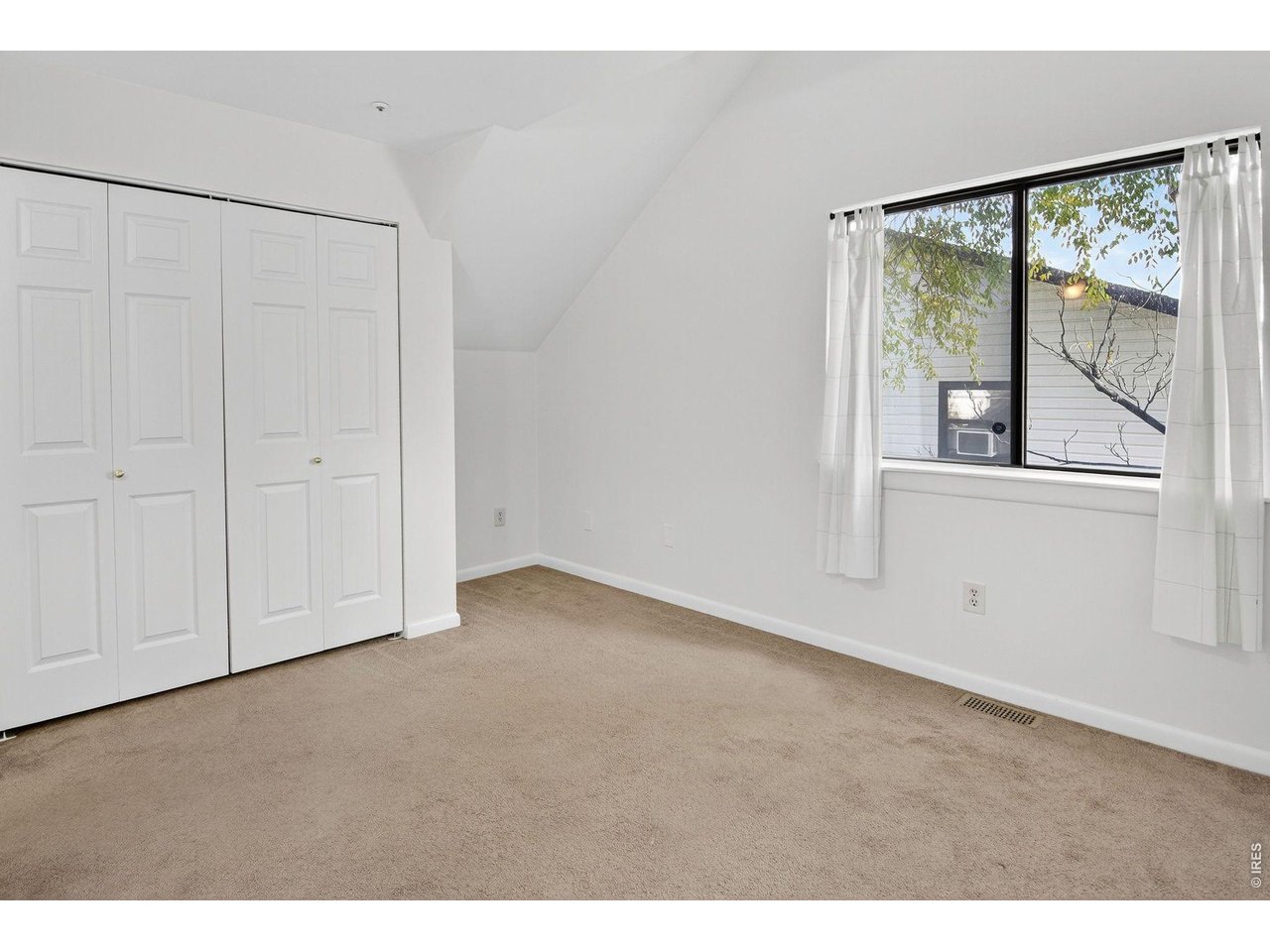 2317 Walnut Street Boulder, CO 80302 - Photo 27 of 34 a view of an empty room with a window