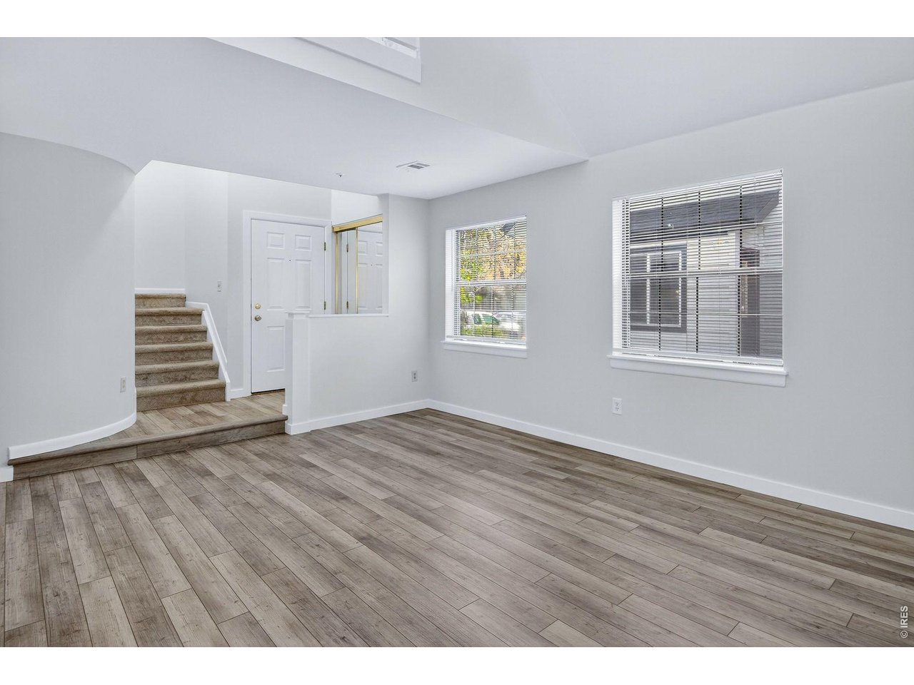2317 Walnut Street Boulder, CO 80302 - Photo 5 of 34 a view of an empty room with wooden floor and a window