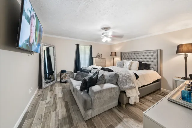 a bed room with a bed and a flat screen tv