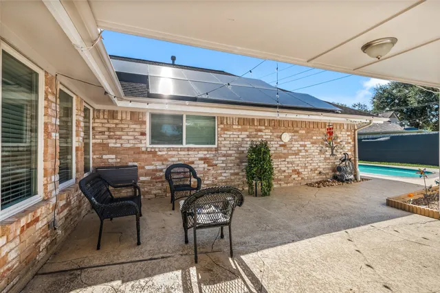 a view of a swimming pool with a yard