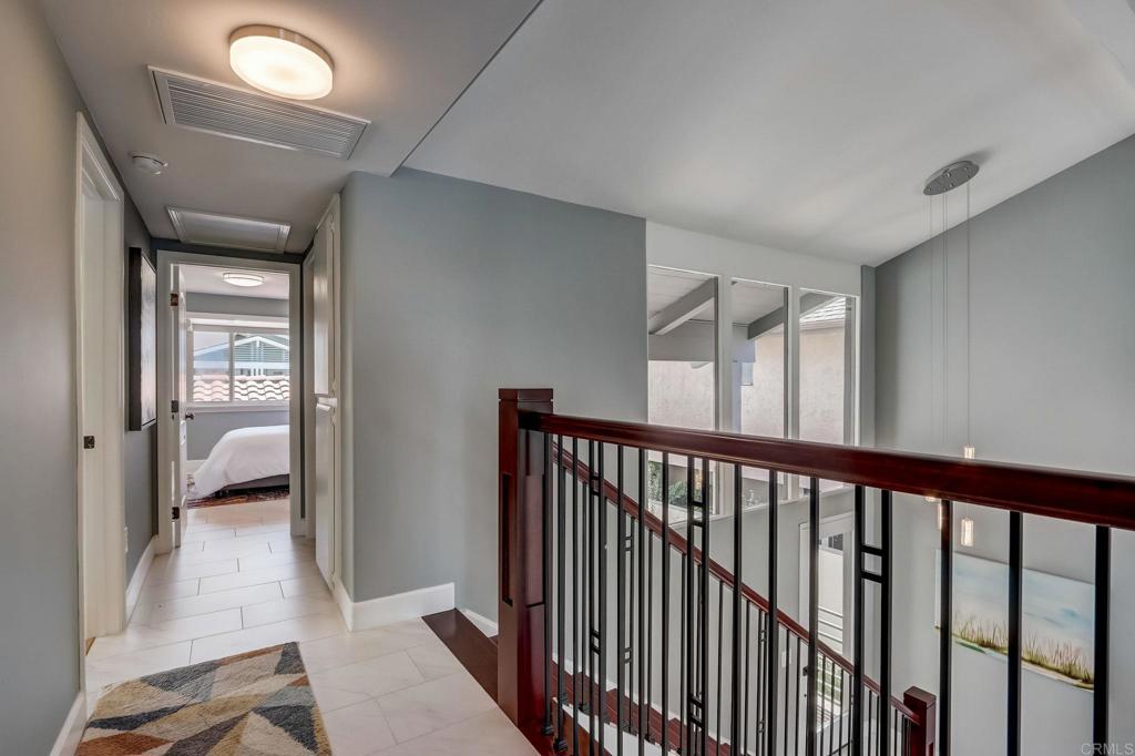 27 Green Turtle Road Coronado, CA 92118 - Photo 23 of 40 a view of a hallway with a livingroom and a bedroom