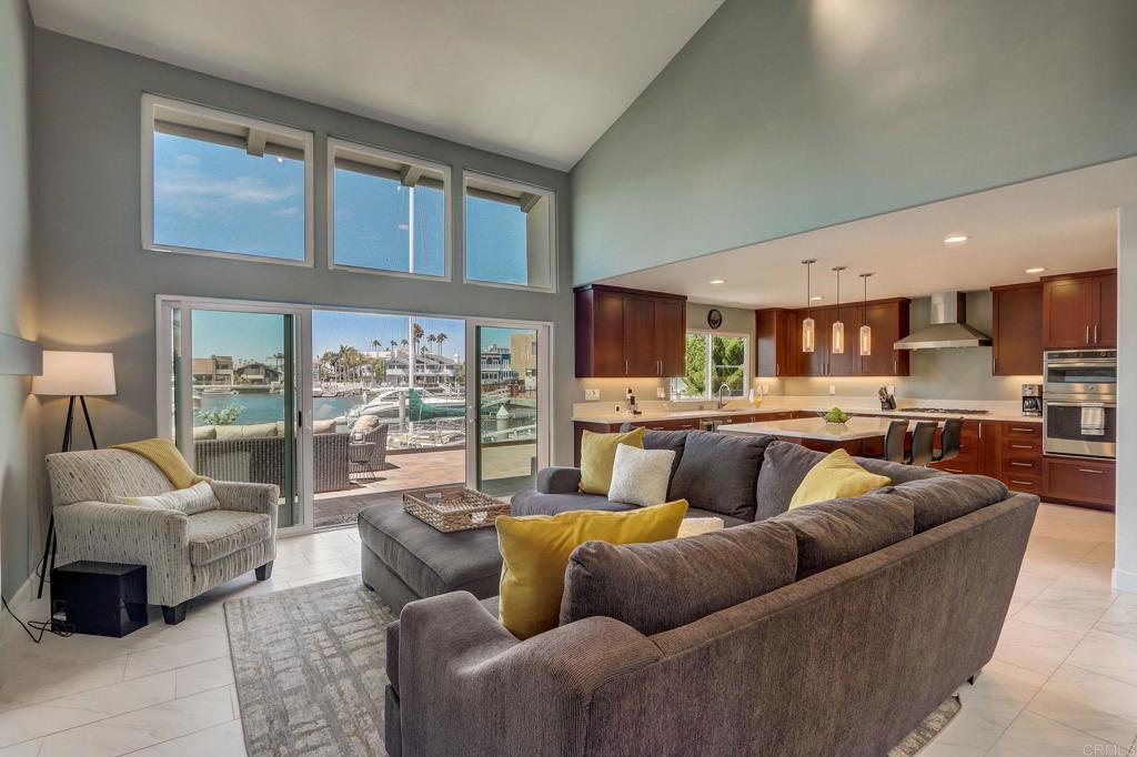 27 Green Turtle Road Coronado, CA 92118 - Photo 9 of 40 a living room with furniture kitchen and a large window
