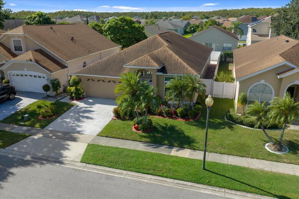 1010 Raining Meadows Lane Orlando, FL 32824 - Photo 3 of 57 aerial view of a house with a yard