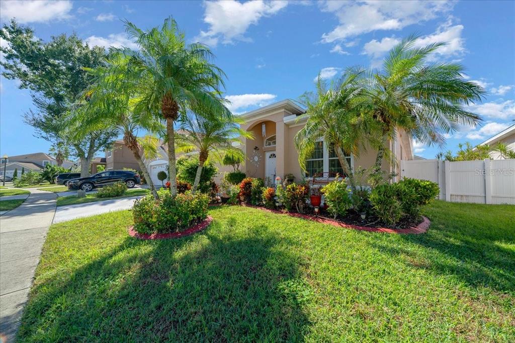 1010 Raining Meadows Lane Orlando, FL 32824 - Photo 52 of 57 a view of a garden with a building