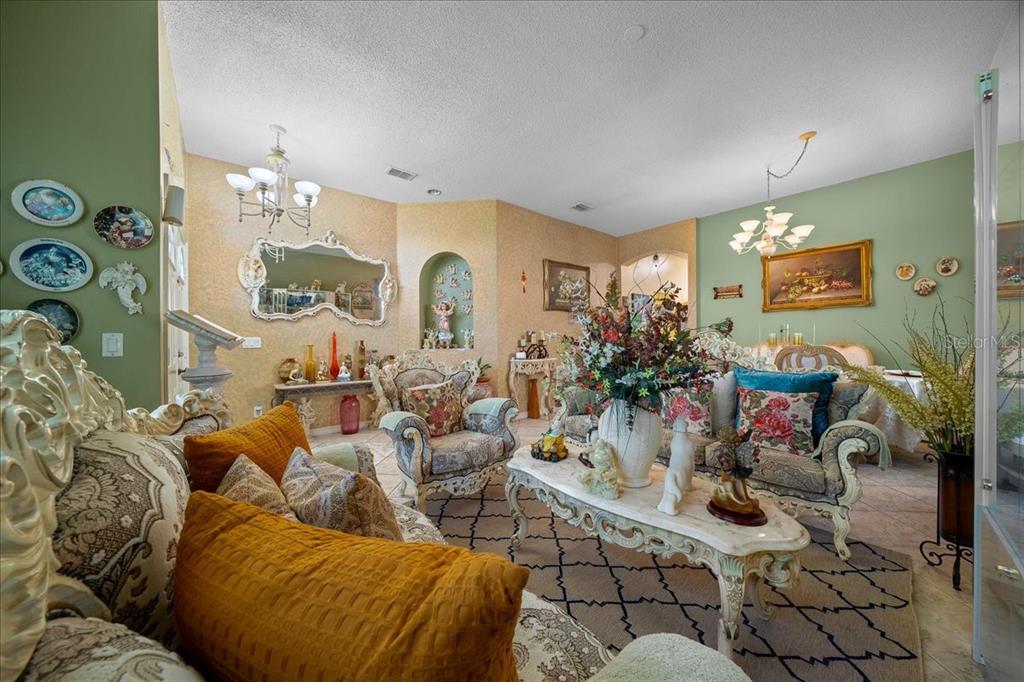 1010 Raining Meadows Lane Orlando, FL 32824 - Photo 7 of 57 a living room with furniture and a flat screen tv