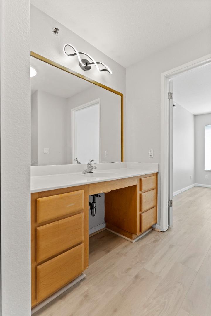 29581 Highgate Drive, Unit 219 Hayward, CA 94544 - Photo 11 of 24 a bathroom with a sink and a mirror