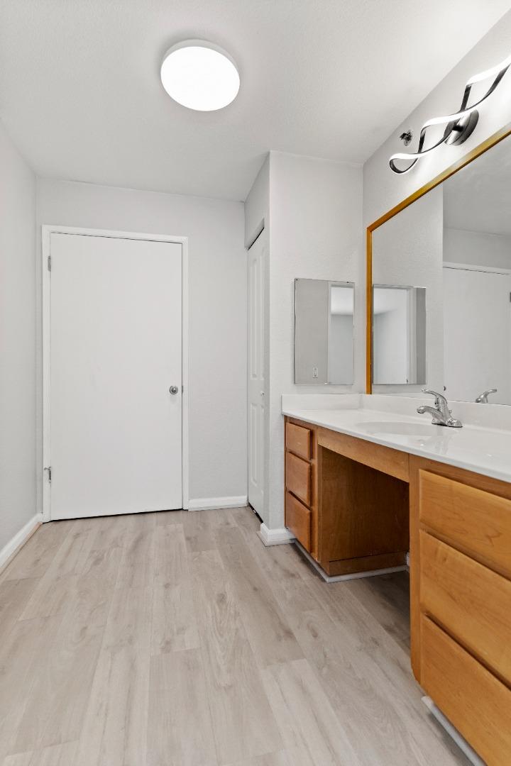 29581 Highgate Drive, Unit 219 Hayward, CA 94544 - Photo 12 of 24 a bathroom with a sink and a mirror