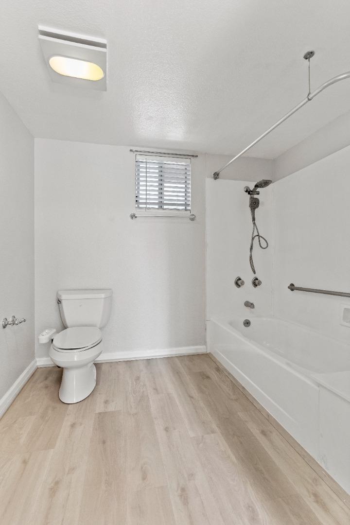 29581 Highgate Drive, Unit 219 Hayward, CA 94544 - Photo 13 of 24 a bathroom with a toilet and a shower