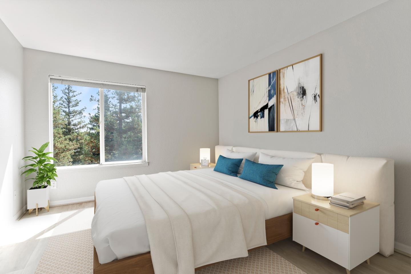 29581 Highgate Drive, Unit 219 Hayward, CA 94544 - Photo 14 of 24 a bedroom with a large bed and a potted plant