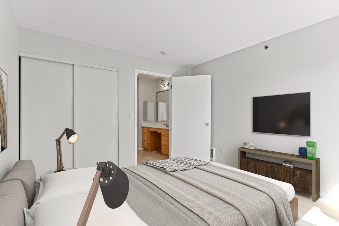 29581 Highgate Drive, Unit 219 Hayward, CA 94544 - Photo 16 of 24 a bedroom with a bed and a flat screen tv