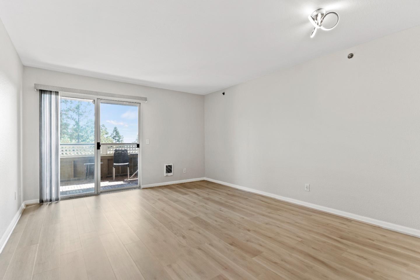 29581 Highgate Drive, Unit 219 Hayward, CA 94544 - Photo 2 of 24 wooden floor in an empty room with a window