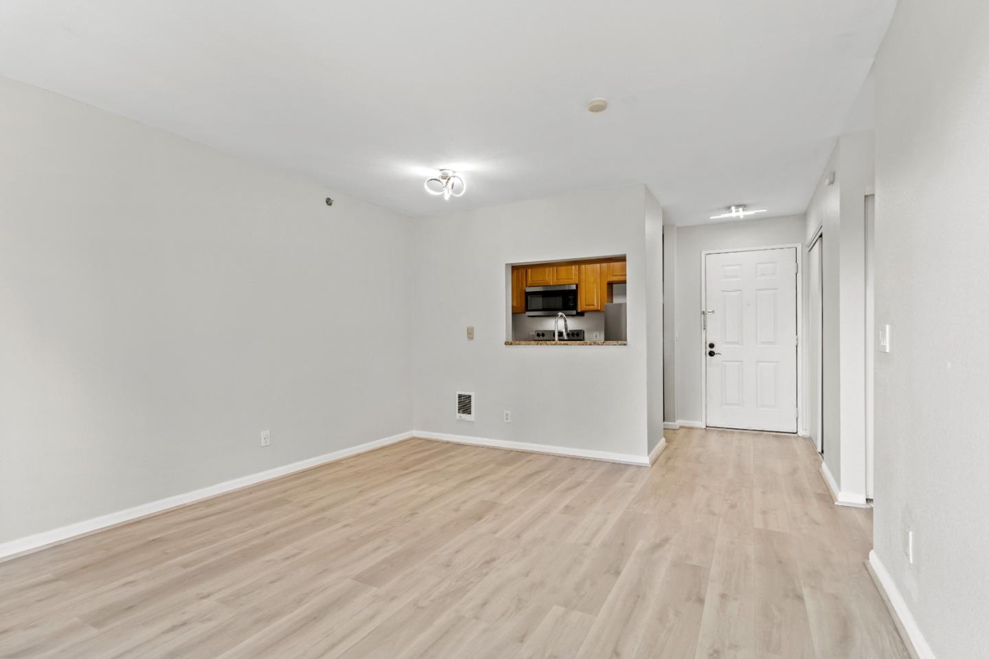 29581 Highgate Drive, Unit 219 Hayward, CA 94544 - Photo 4 of 24 a view of an empty room and wooden floor