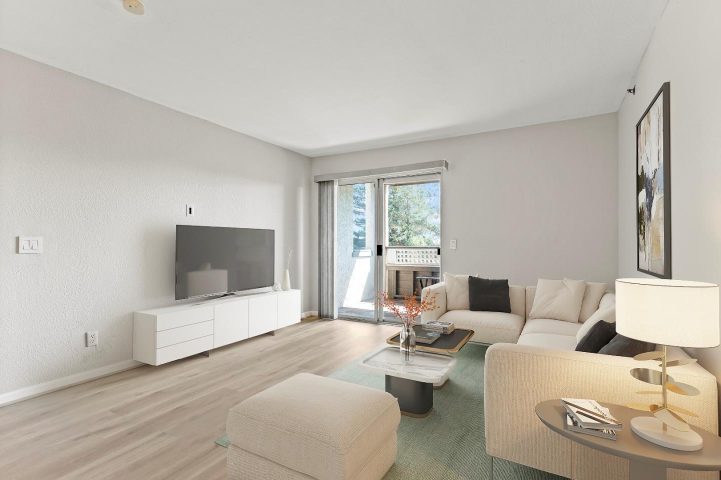 29581 Highgate Drive, Unit 219 Hayward, CA 94544 - Photo 5 of 24 a living room with furniture and a flat screen tv