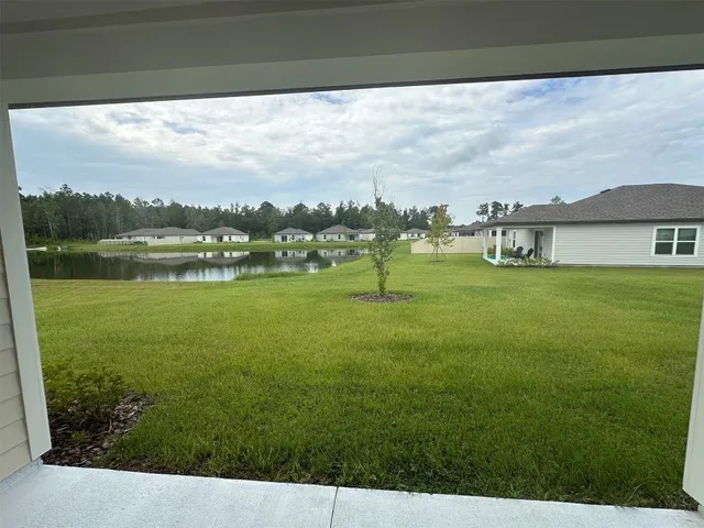 a view of a lake with a big yard