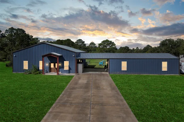 a front view of a house with yard