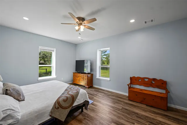 a bedroom with furniture and a window