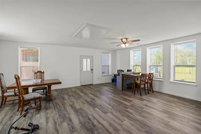 a view of a dining room with furniture and window