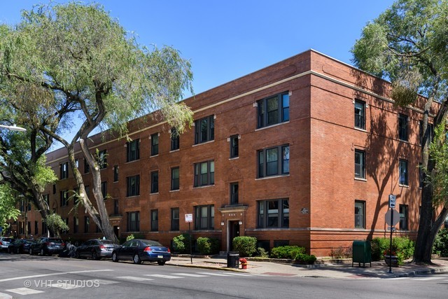 Undisclosed Address Chicago, IL 60657 - Photo 1 of 9 a front view of a building and a street