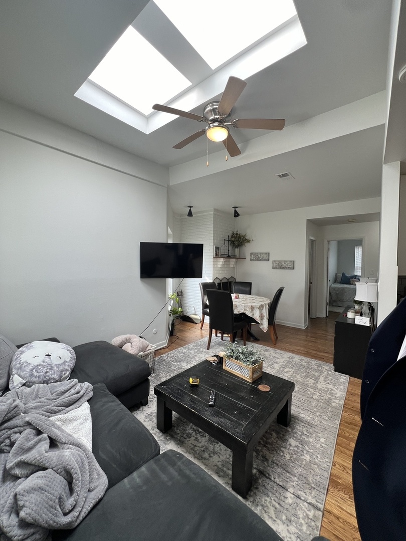 Undisclosed Address Chicago, IL 60657 - Photo 2 of 9 a living room with furniture and wooden floor