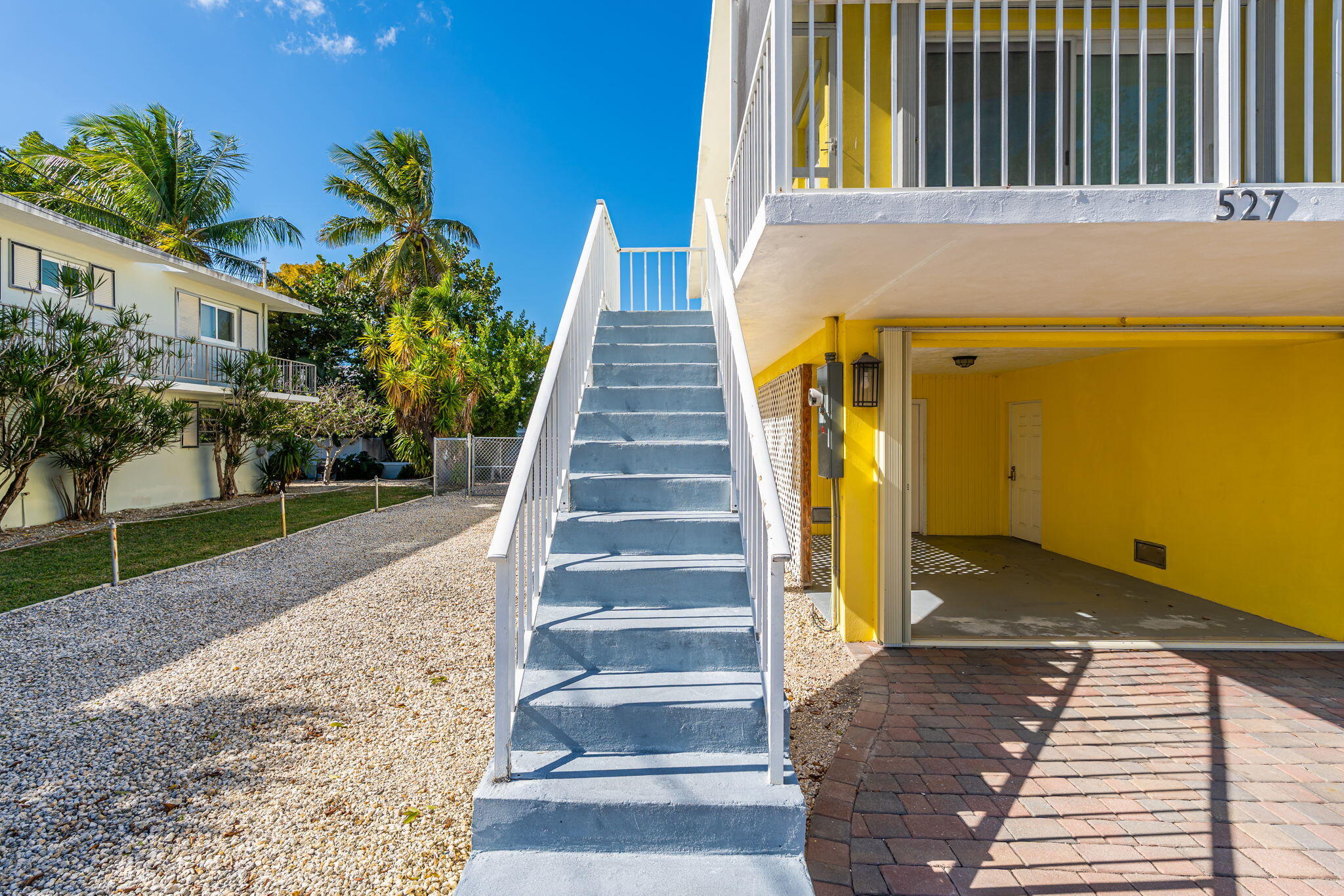 527 Sound Drive Key Largo, FL 33037 - Photo 16 of 50 a view of a house with entrance and stairs