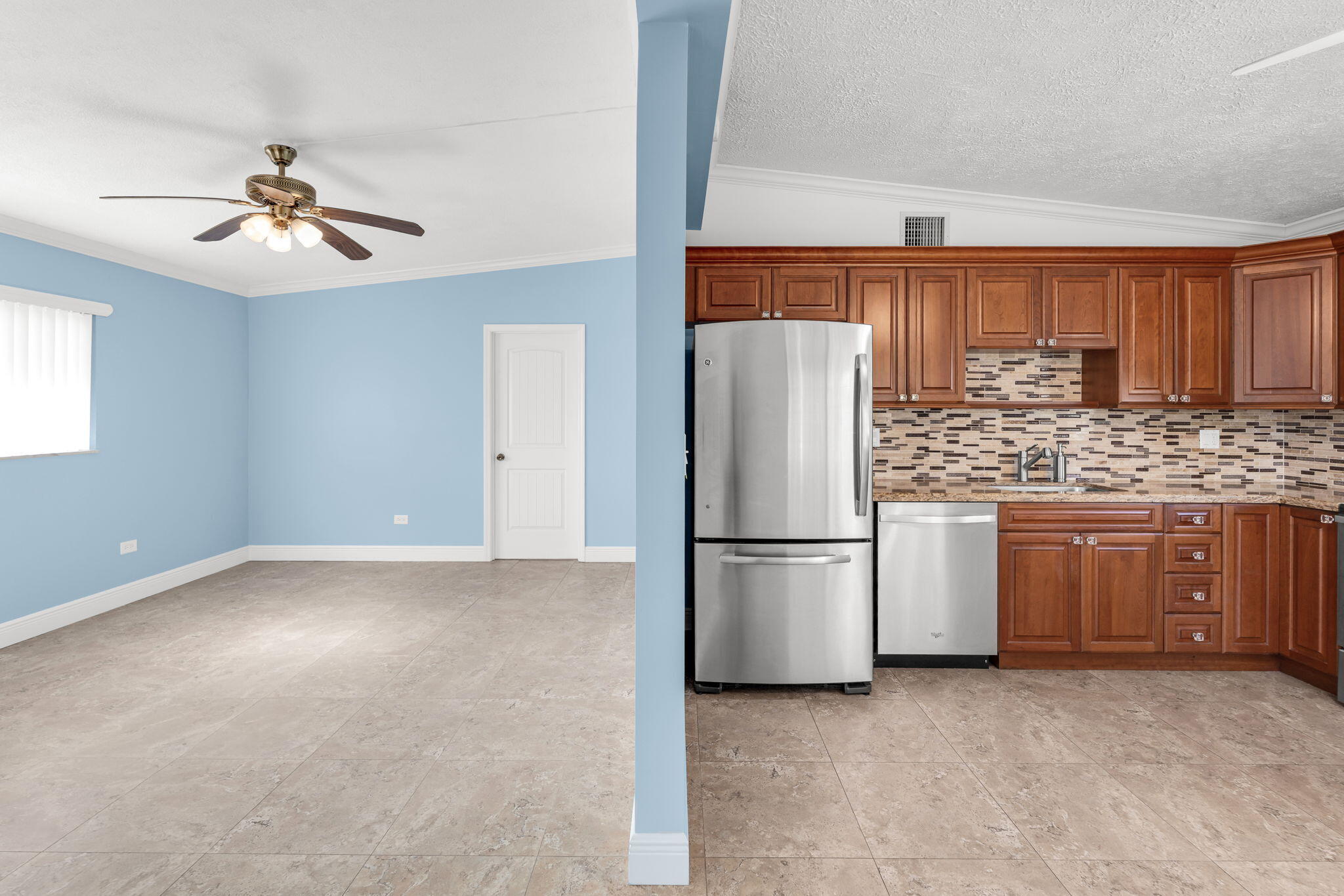 527 Sound Drive Key Largo, FL 33037 - Photo 24 of 50 a kitchen with a refrigerator a stove top oven a sink and cabinets