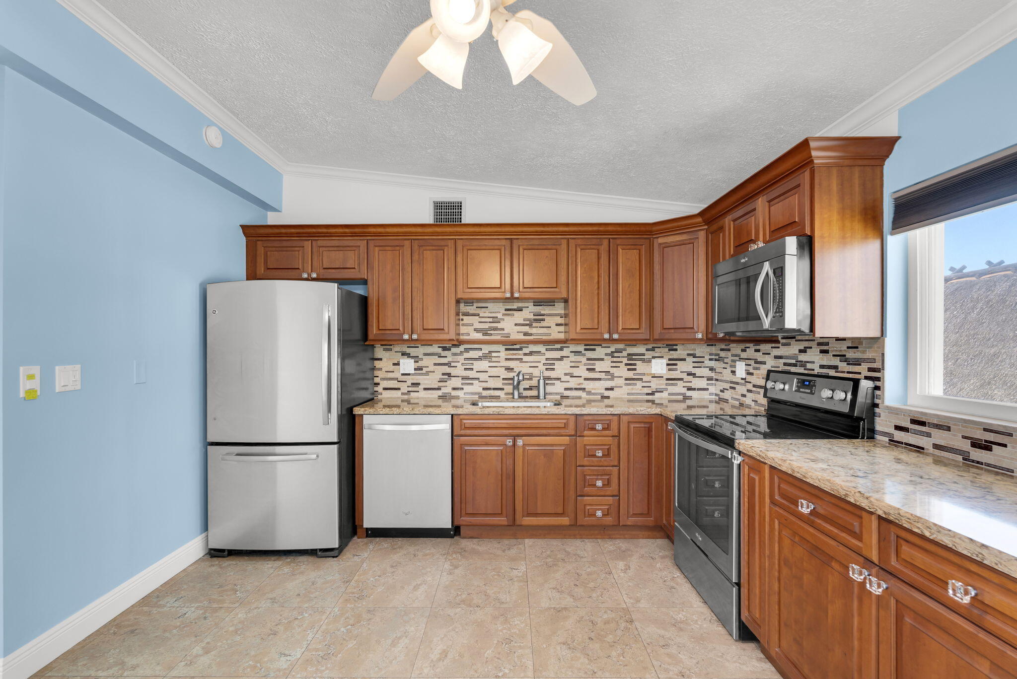 527 Sound Drive Key Largo, FL 33037 - Photo 26 of 50 a kitchen with stainless steel appliances granite countertop a refrigerator a stove a sink and a refrigerator