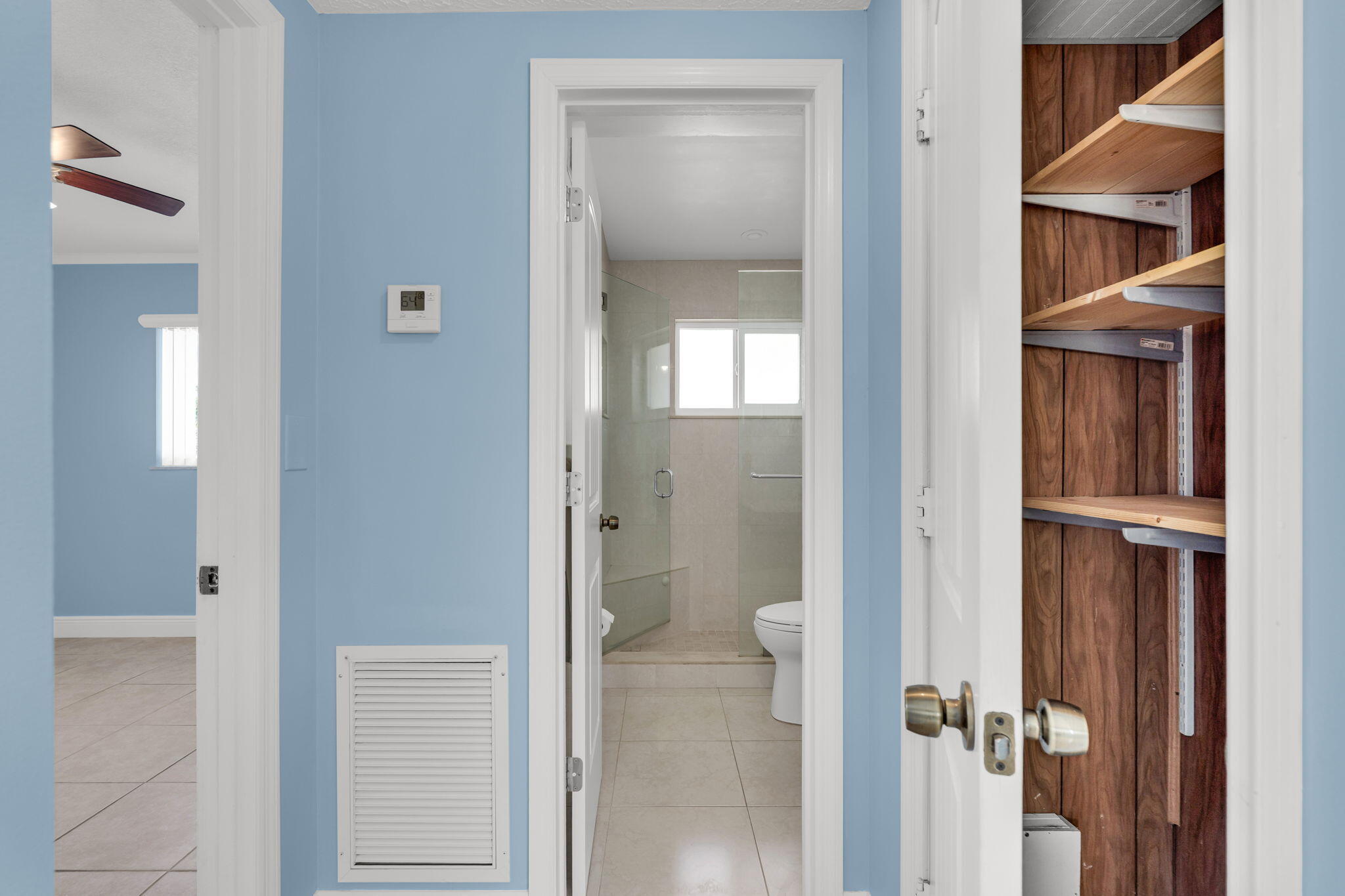 527 Sound Drive Key Largo, FL 33037 - Photo 29 of 50 a bathroom with a glass shower door