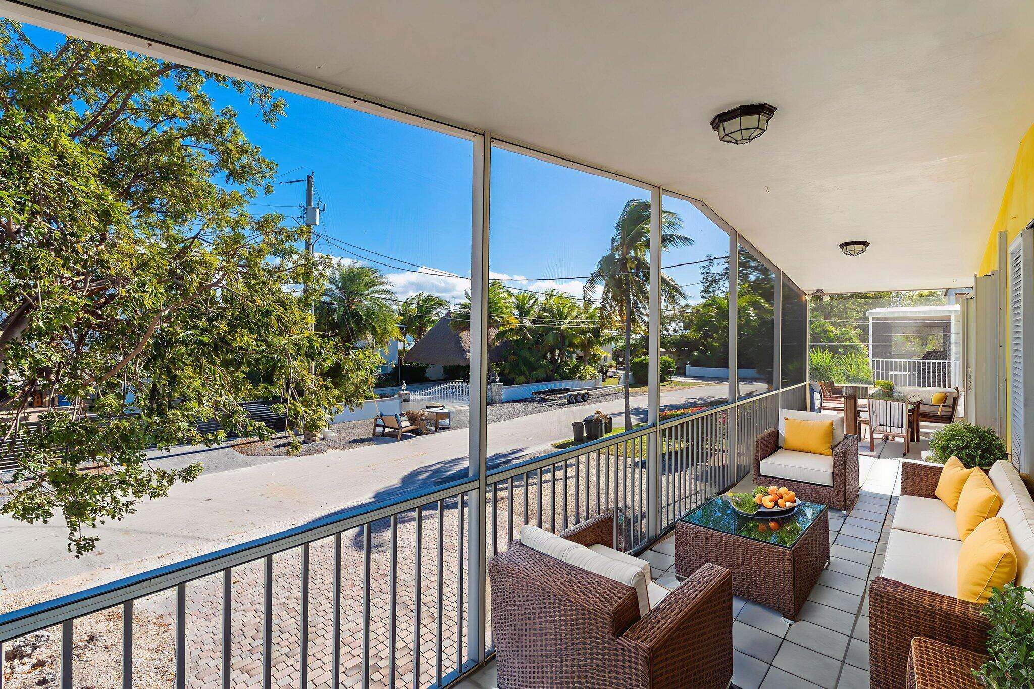 527 Sound Drive Key Largo, FL 33037 - Photo 3 of 50 a view of roof deck with couches and potted plants