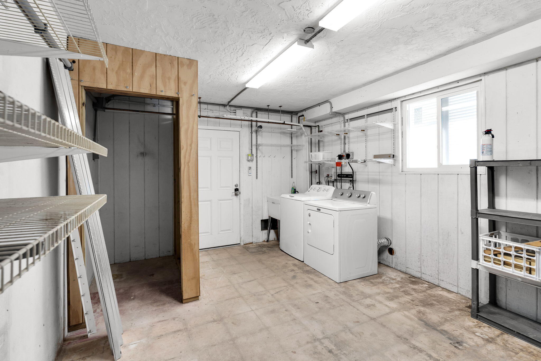527 Sound Drive Key Largo, FL 33037 - Photo 34 of 50 a utility room with cabinets washer and dryer