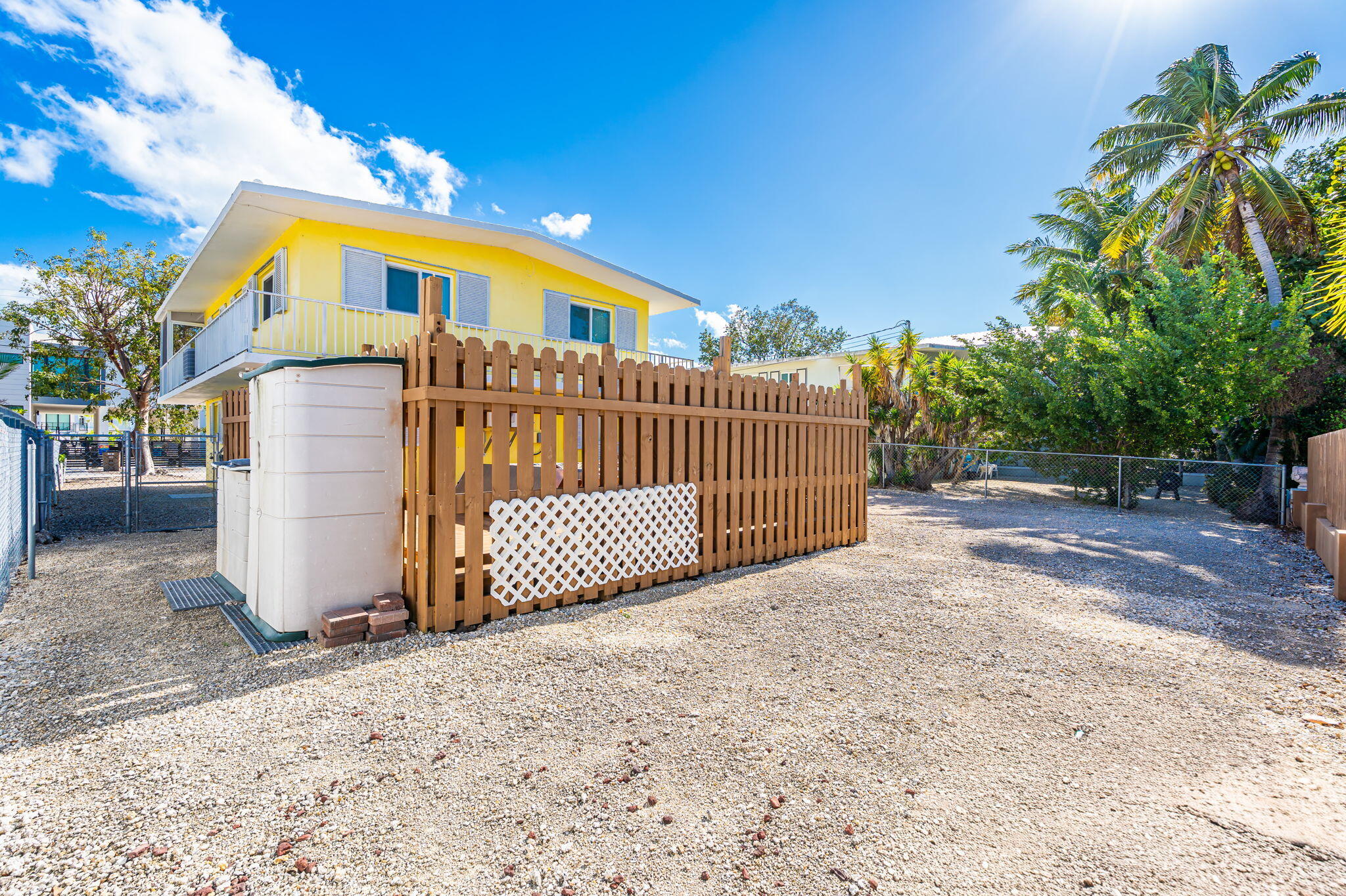 527 Sound Drive Key Largo, FL 33037 - Photo 38 of 50 a view of a house with a wooden fence