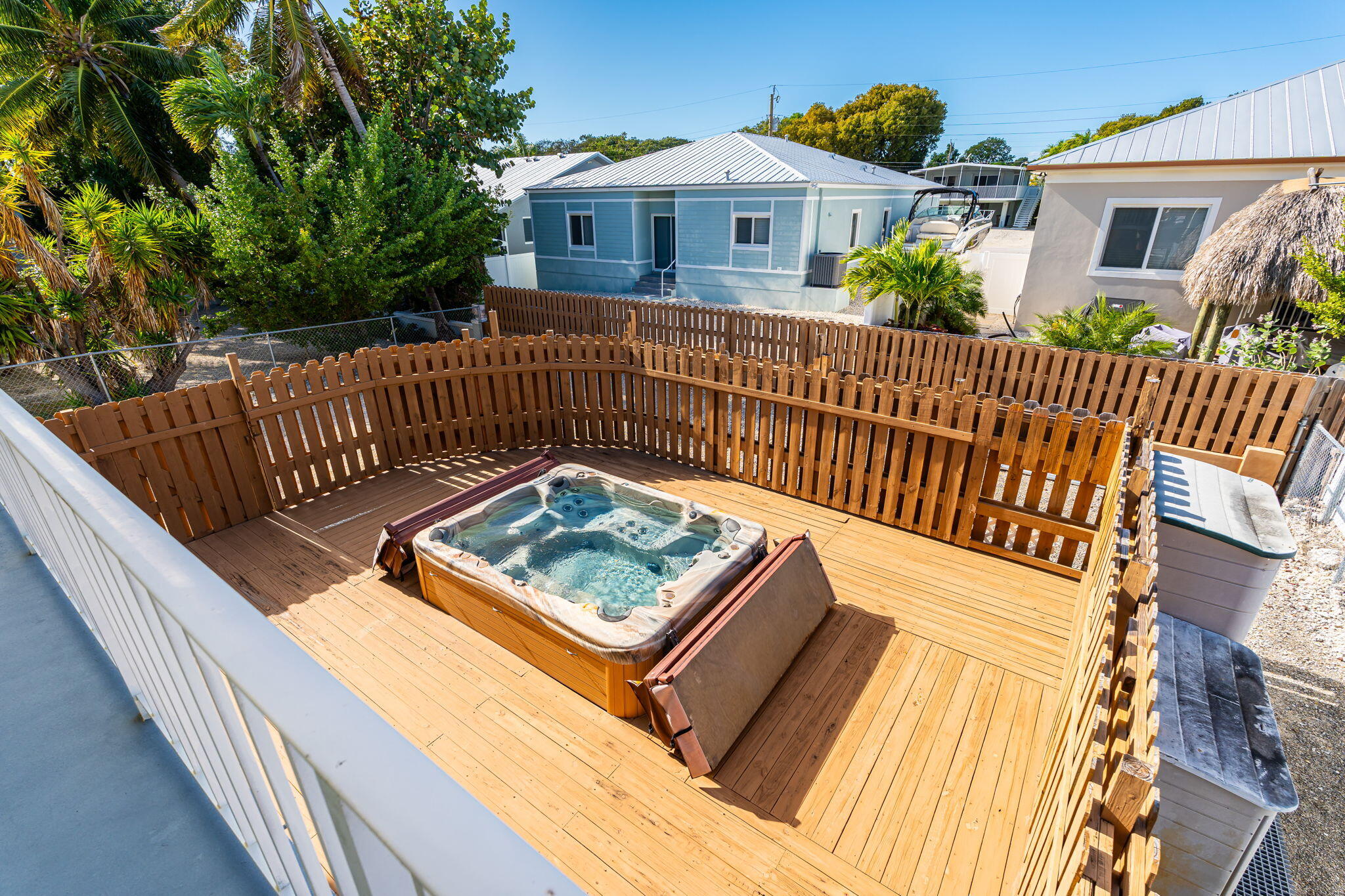 527 Sound Drive Key Largo, FL 33037 - Photo 43 of 50 a view of a roof deck with wooden fence and wooden floor