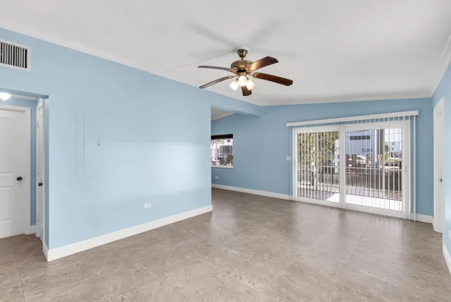 a view of an empty room with a window