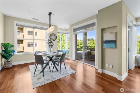 a view of a dining room with furniture window and wooden floor