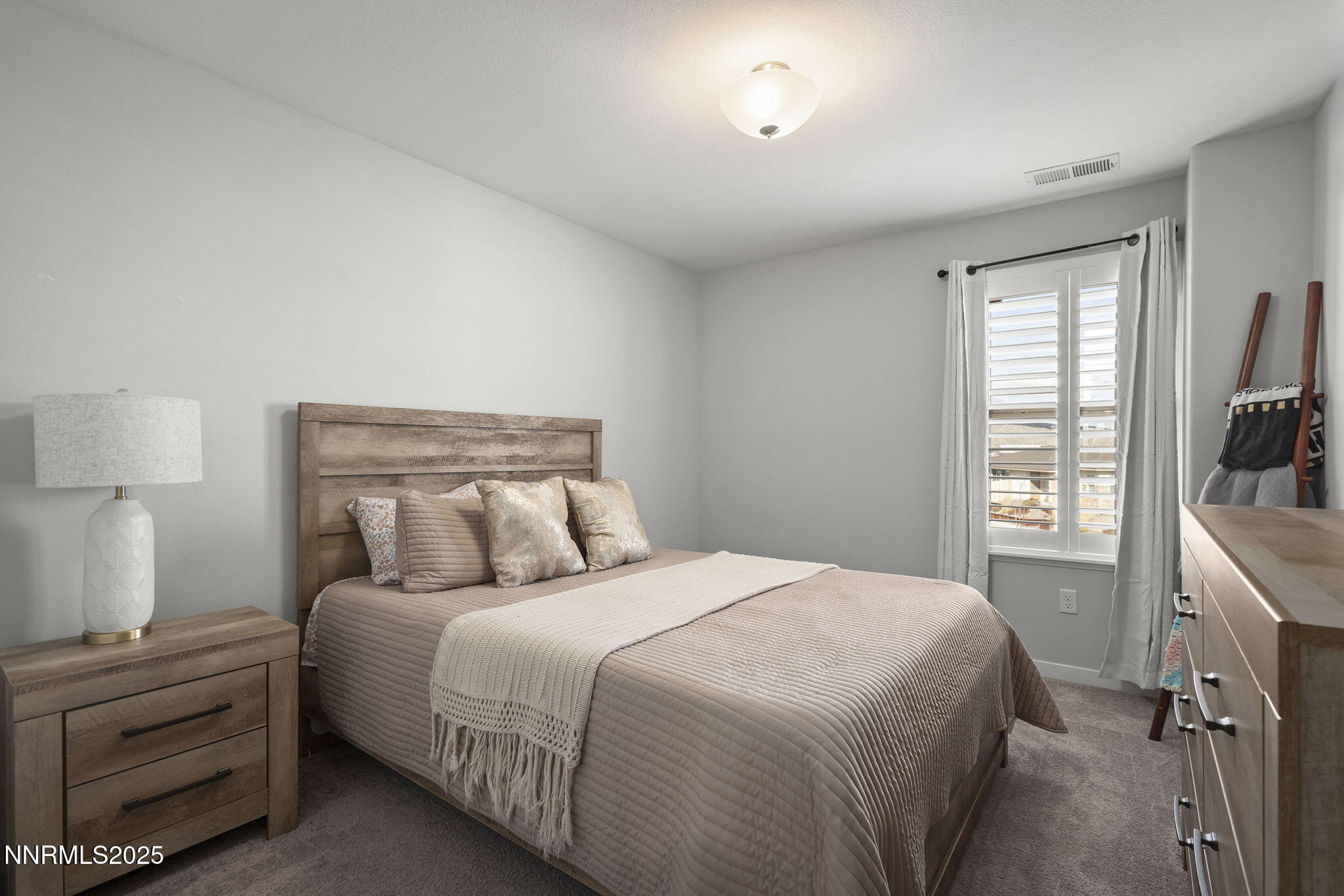 7181 Mustengo Drive Reno, NV 89506 - Photo 15 of 37 a bedroom with a bed and a window