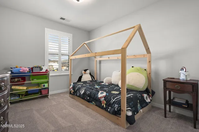 a bed room with a bed and a window