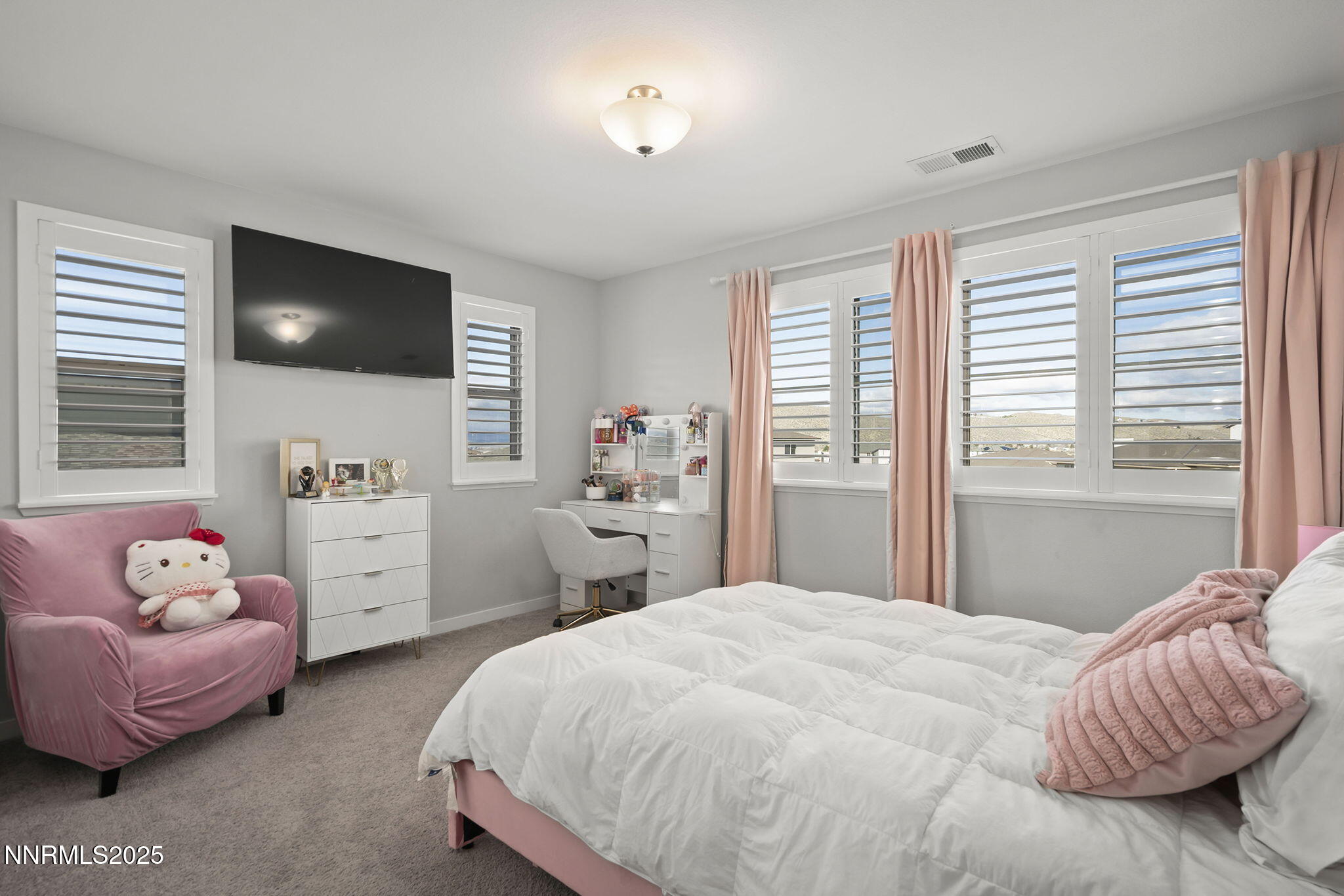 7181 Mustengo Drive Reno, NV 89506 - Photo 18 of 37 a bedroom with a bed and a couch