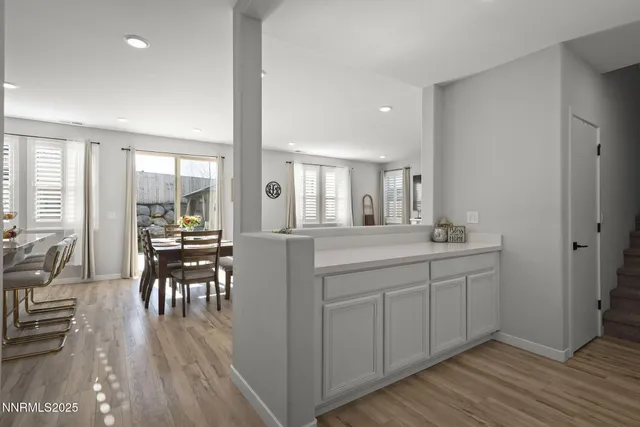 a kitchen with sink and cabinets