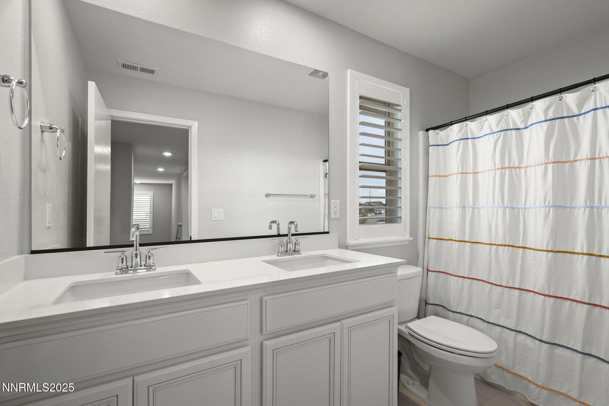 7181 Mustengo Drive Reno, NV 89506 - Photo 21 of 37 a bathroom with a sink toilet and shower