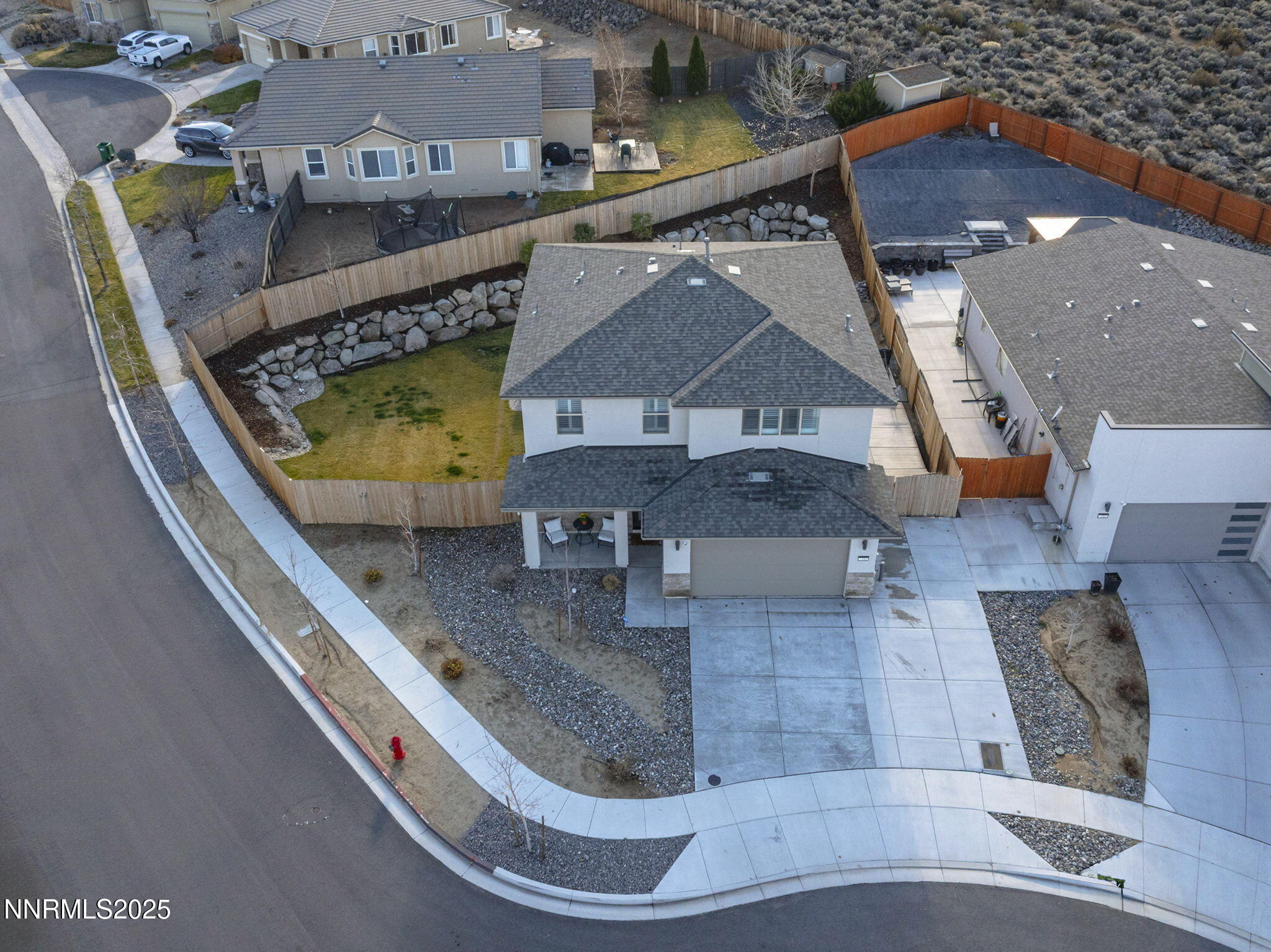 7181 Mustengo Drive Reno, NV 89506 - Photo 34 of 37 an aerial view of a house with a swimming pool