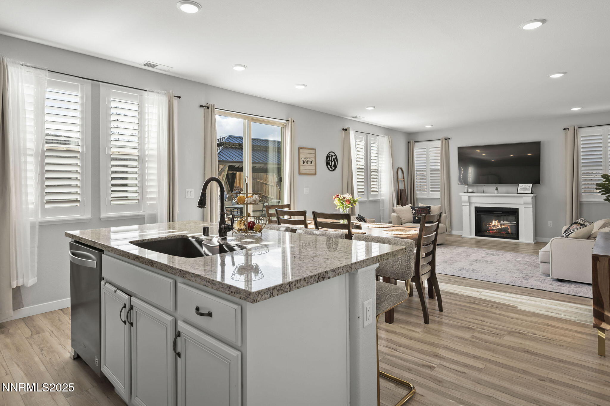 7181 Mustengo Drive Reno, NV 89506 - Photo 6 of 37 a kitchen with center island appliances and a large window