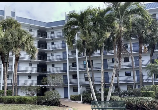 a view of a building with a tree