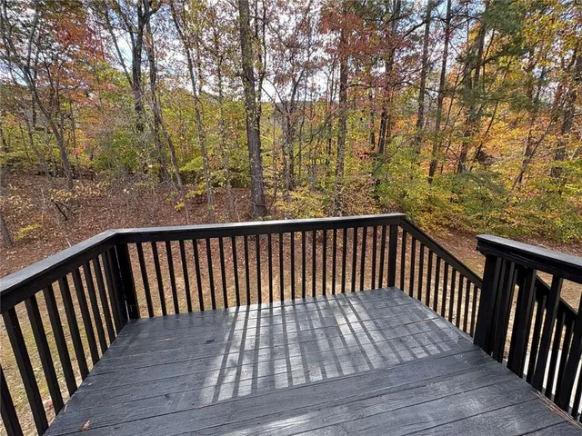 a view of balcony with wooden floor