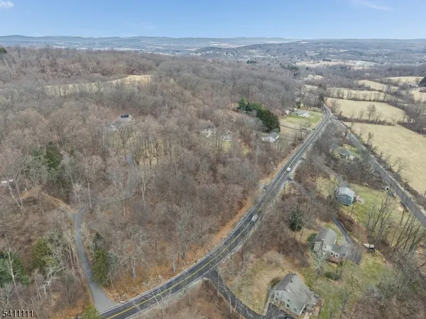 a large kitchen with stainless steel appliances granite countertop a stove a sink and a refrigerator
