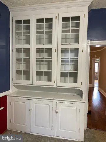 a view of kitchen with granite countertop a window