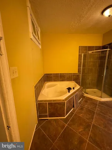 a bathroom with a sink and shower