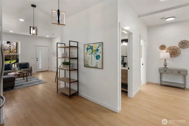 a view of a patio with table and chairs and wooden floor