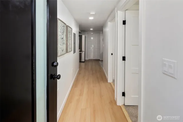 a kitchen with a sink and white cabinets