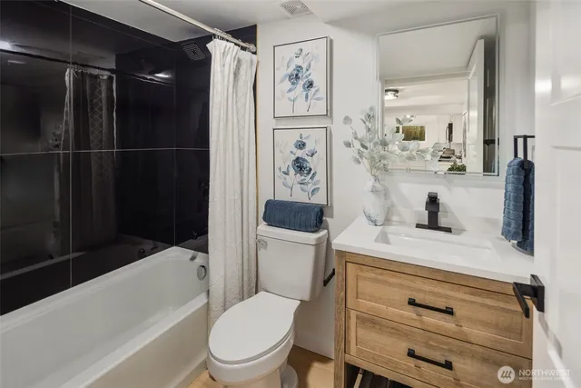 a bedroom with a bed table and a window