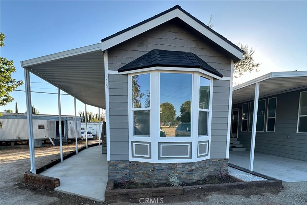 22113 Grand Terrace Road, Unit 16 Grand Terrace, CA 92313 - Photo 2 of 15 a tall building with a outdoor space